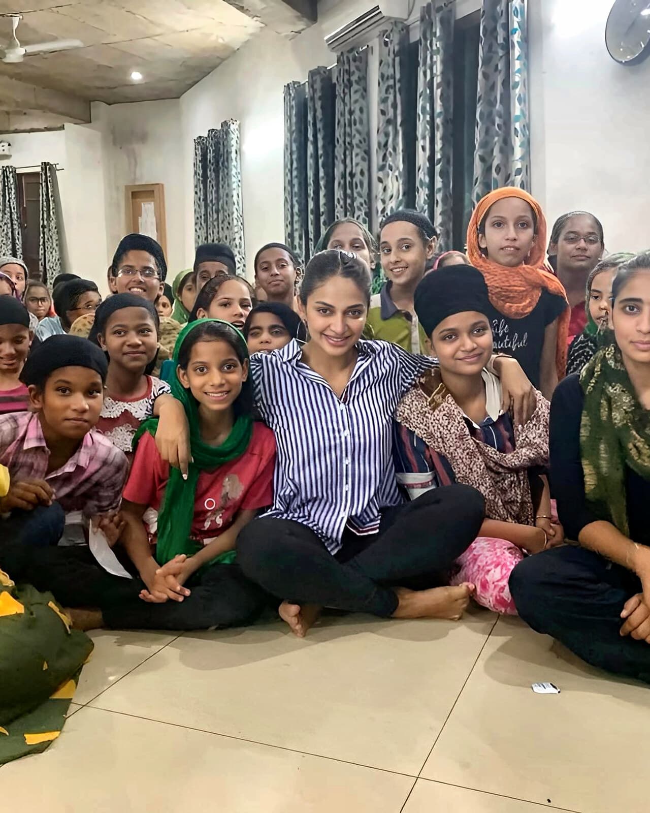 Rubina Bajwa with children during philanthropic work for The Chahal Foundation